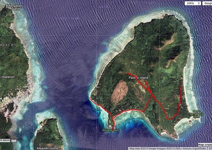 The satellite image of Patoo Island reveals the lush green vegetation, with brown patches indicating cleared areas. Red lines mark paths or routes for island hopping adventures or boat tours, showcasing the surrounding waters and nearby islands in this picturesque landscape.