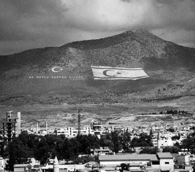 turkish-symbols-and-turkish-cypriot-flags-in-besparnak-mountain-overlooking-nicosia-cyprus-joe-fox